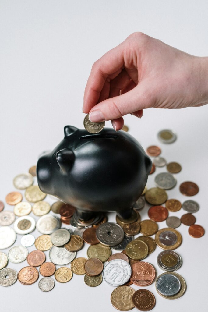 “woman saving coins in jar”